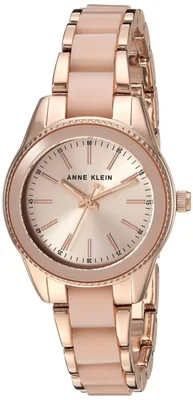 Reloj Anne Klein para mujer en tono oro rosa con resina rosa claro