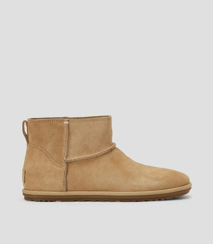 Botas planas en piel Mujer