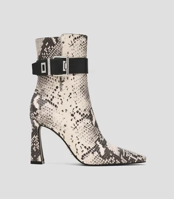 Botines con tacón alto media luna Mujer