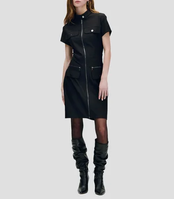 Vestido negro entallado de punto con textura, cierre frontal y detalles metálicos Mujer